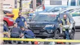  ?? ROBERTO E. ROSALES/JOURNAL ?? An APD officer and paramedics perform CPR on a man shot by police in the parking lot of Smith’s grocery store on Yale and Coal on Saturday.