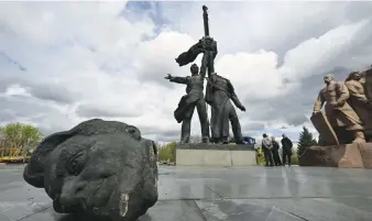  ?? Picture: AFP ?? DESTRUCTIO­N. Workers dismantle the Soviet monument to Ukraine-Russia friendship in Kyiv on Tuesday.