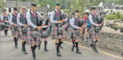  ??  ?? Doune and Deanston Pipe Band led the parade from the Falls of Dochart.