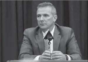  ?? The Associated Press ?? MYERS RETIRING: Ohio State NCAA college football head coach Urban Meyer answers questions during a news conference announcing his retirement Tuesday in Columbus, Ohio.