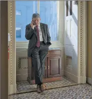  ?? AP/J. SCOTT APPLEWHITE ?? Sen. Joe Manchin does a phone interview with a news outlet in a corridor at the Capitol in Washington on Tuesday after Rep. Tom Marino, President Donald Trump’s nominee to be the nation’s drug czar, withdrew from considerat­ion.