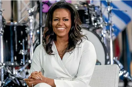  ?? AP ?? In her new memoir, former US first lady Michelle Obama says she will ‘‘never forgive’’ a ‘‘reckless’’ Donald Trump for putting her family’s safety at risk by questionin­g whether her husband Barack was an American citizen.