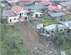  ?? Efe ?? DAÑOS. Viviendas destruidas en una zona de Balacbac, Baguio, al norte de Manila, Pilipinas.