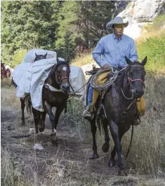  ??  ?? Don’t let the thought of an overnight pack trip daunt you. Almost any seasoned trail rider on a conditione­d trail horse with calm pack horses can make the trip—if properly prepared.