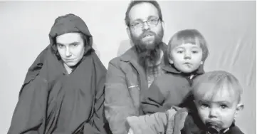  ??  ?? A still image from a video posted by the Taliban on social media shows American Caitlan Coleman (left) speaking next to her Canadian husband Joshua Boyle and their two sons. — Reuters photo