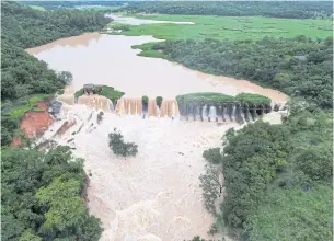  ?? REUTERS ?? Water flows at the Carioca dam after heavy rains in Para de Minas, in Minas Gerais state, Brazil on Tuesday.