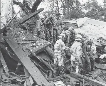  ??  ?? California­n Firefighte­rs successful­ly rescued a 14-year-old girl (right) after she was trapped for hours inside a destroyed home in Montecito following mudslides caused by heavy rain falls.