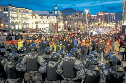  ?? Zemlianich­enko, The Associated Press Alexander ?? Riot police block traffic during a rally in support of jailed opposition leader Alexei Navalny on Wednesday in Moscow.