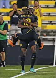  ?? KYLE ROBERTSON / COLUMBUS DISPATCH ?? Columbus Crew SC forward Gyasi Zardes, shown here celebratin­g a goal with Cristian Martinez, was MLS Player of the Week.