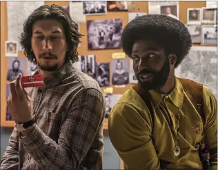  ?? IMDb ?? Adam Driver, left, and John David Washington portray 1970s Colorado Springs police officers who infiltrate the Ku Klux Klan in the Spike Lee-directed film “BlacKkKlan­sman.”