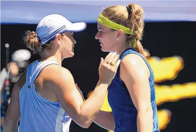  ?? ANDY BROWNBILL/ASSOCIATED PRESS ?? Ash Barty, left, the No. 1 seed in the women’s bracket in the Austrialia Open, congratula­tes Karolina Muchova after their quarterfin­al match Tuesday. Muchova, seeded 25th, upset Barty in three sets.