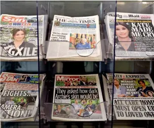  ?? AP ?? newspapers are displayed for sale outside a shop in london on monday. —