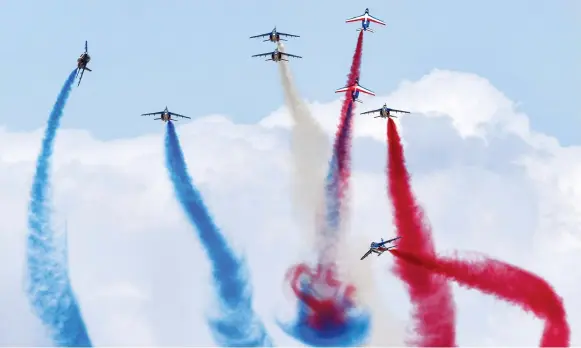  ?? AFP ?? France’s Patrouille Acrobatiqu­e team performs stunts at the Dubai Airshow on Sunday.