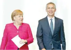  ?? — Reuters ?? German Chancellor Angela Merkel and Nato Secretary-general Jens Stoltenber­g arrive to address a news conference in the German Chanceller­y in Berlin, on Friday.