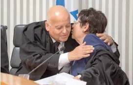  ?? (Pool/Emil Salman, Haaretz) ?? SUPREME COURT President Miriam Naor gives a farewell hug to retiring deputy, Salim Joubran, yesterday.