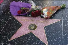  ?? CHRIS PIZZELLO — THE ASSOCIATED PRESS ?? Flowers lie atop the star of the late Suzanne Somers along the Hollywood Walk of Fame on Monday in Los Angeles. She died Sunday morning at 76.