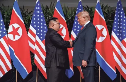  ?? EVAN VUCCI/AP ?? President Donald Trump meets with North Korea’s Kim Jong Un on Sentosa Island in Singapore on June 12.