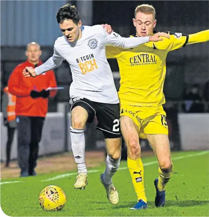  ??  ?? Ayr’’s Liam Smith tussles for the ball with Zak Rudden