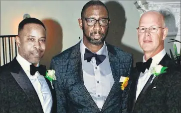  ?? Courtesy of Mark Chambers ?? TIMOTHY DEAN, center, with friend Mark Chambers, left. Dean is the second black man to have been found dead in the West Hollywood apartment of Democratic donor Ed Buck. Dean’s body was found last week.