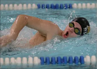  ?? PHOTOS BY MATT STONE — BOSTON HERALD ?? Jack Morgan of Boston Latin Academy swims the mixed 200 yard freestyle during the Boston City League co-ed swimming championsh­ip at Madison Park.