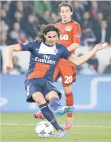  ??  ?? Paris Saint Germain Uruguayan forward Edinson Cavani kicks the ball during the UEFA Champions League last 16 second-leg match against Bayer Leverkusen in Paris. — AFP photo