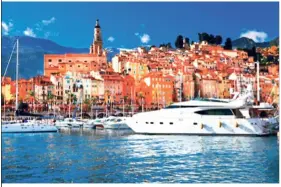  ??  ?? Colourful buildings off the Cote d’Azur contrasted by the azure waters of the Mediterran­ean.