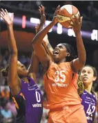  ?? Sean D. Elliot / Associated Press ?? Connecticu­t Sun center Jonquel Jones ( 35) battles Phoenix Mercury defenders Angel Robinson ( 0) and Brittney Griner ( 42) in a July 13 game.