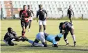  ?? Picture: ALAN EASON ?? PULLING POWER: OR Tambo take down a Nelson Mandela Bay player in their Steve Vukile Tshwete Games clash.