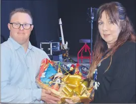  ?? (Pic: John Ahern) ?? NICE WIN PATRICK: Concert committee member, Sinead O’Shea, presenting Patrick Buckley, from Lismore, with the hamper he won at the ‘Night With The Country Stars’ in Cappoquin Community Centre.