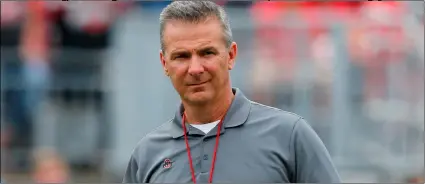  ??  ?? In this April 14 file photo, Ohio Setate coach Urban Meyer watches the NCAA college team’s spring game in Columbus, Ohio. AP PhoTo/JAy lAPreTe