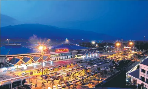  ??  ?? A night view of Chiang Mai airport, which is increasing­ly becoming a port of call for Chinese airlines.