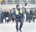  ??  ?? Toronto police have periodical­ly worked at busy intersecti­ons in recent years, keeping order during rush hours.