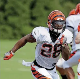  ?? [AP PHOTO] ?? Bengals running back and former Oklahoma star Joe Mixon (28) has impressed Cincinnati’s coaching staff at training camp.