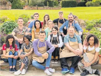  ??  ?? All set The contestant­s in this year’s Bake Off, including Michael Chakravert­y, pictured front in purple. Picture by Michael Bourdillon/Love Production­s