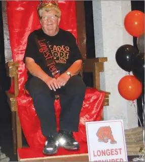  ?? Westside Eagle Observer/SUSAN HOLLAND ?? Margaret Martin, a first-grade teacher at Glenn Duffy Elementary School, was honored as the longest-tenured teacher in the Gravette School District at the Back to School Appreciati­on Day. Martin, who has taught 52 years at the elementary school, was seated on a special throne and given a crown, sash and sign to designate her special spot in the school parking lot.