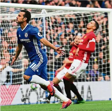  ?? — Reuters ?? He’s too quick: Chelsea’s Pedro Rodriguez (left) celebrates after scoring against Manchester United at Stamford Bridge yesterday. Chelsea won 4-0.