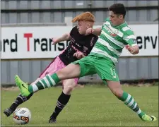  ??  ?? Adam Feeney under pressure from Adam Doyle of Shamrock Rovers.