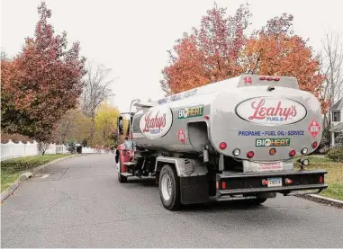  ?? H John Voorhees III / Hearst Connecticu­t Media file photo ?? Leahy’s Fuels makes a heating-oil delivery to a Danbury home.