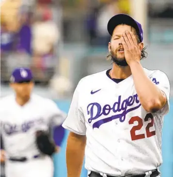  ?? MARK J. TERRILL AP ?? Dodgers starting pitcher Clayton Kershaw needs a minute during NLDS Game 2 loss to Padres last October.