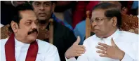  ?? Reuters ?? Mahinda rajapaksa and Maithripal­a sirisena talk during a rally near parliament in Colombo on Monday. —