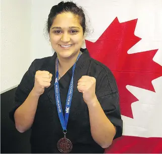  ?? KEN PAGAN ?? Carmel Rouhani won a bronze medal for Team Canada at the World Karate and Kickboxing Council World Championsh­ips in Portugal in 2010.