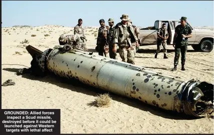  ?? ?? GROUNDED: Allied forces inspect a Scud missile, destroyed before it could be launched against Western targets with lethal affect