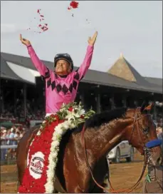  ?? PHOTO COURTESY SPENCER TULIS ?? Jockey Mike Smith throws up roses from the Travers Stakes blanket that adorns West Coast, the winner of the 148th Travers Stakes at Saratoga Race Course.