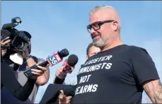  ??  ?? The Associated Press
Proud Boys organizer Joseph Biggs walks from the George C. Young Federal Annex Courthouse in Orlando, Fla., after a court hearing regarding his involvemen­t in the storming of the U.S. Capitol on Jan. 6.