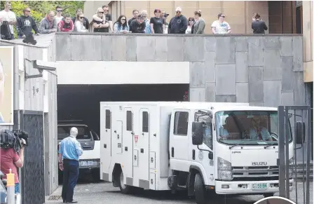  ??  ?? James Duffy leaves the Supreme Court in Hobart after being sentenced over the shooting ing murder of Jarrod Leigh Turner, right.