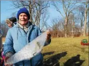  ?? LISA MITCHELL - DIGITAL FIRST MEDIA ?? Dreibelbis Farm Historical Society President Mark Dreibelbis holding a chunk of ice from the 19th century Pennsylvan­ia German ice harvesting demo he hosted at the Historic Dreibelbis Farm in Virginvill­e on Feb. 3.