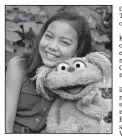  ?? Sesame Workshop vi AP/FLYNN LARSEN ?? This undated image shows 10-year-old Salia Woodbury, whose parents are in recovery, with Sesame Street character Karli. Sesame Workshop is now addressing the problem of addiction.