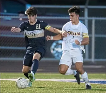  ?? Emily Matthews/Post-Gazette ?? Franklin Regional’s Anthony DiFalco battled Plum’s Michael Weleski for the ball in a match earlier this season. DiFalco recently netted his 100th goal for the Panthers.