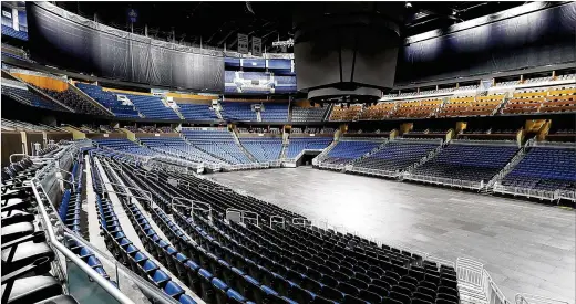  ?? STEPHEN M. DOWELL / ORLANDO SENTINEL / TNS ?? The Amway Center, home of the Orlando Magic in Orlando, Fla., sits empty March 12 after the NBA announced the season would be suspended due to the coronaviru­s. Multiple players in the league have tested positive for the virus.