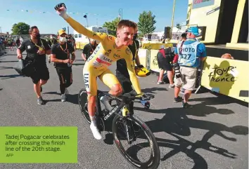  ?? AFP ?? Tadej Pogacar celebrates after crossing the finish line of the 20th stage.